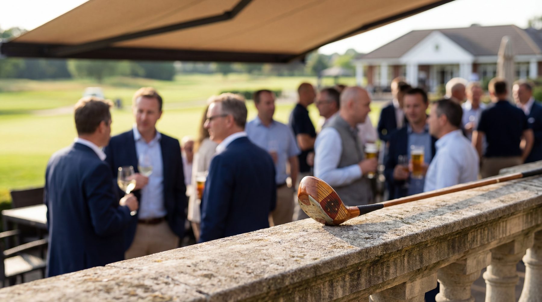Guests networking with drinks at an outdoor golf club event